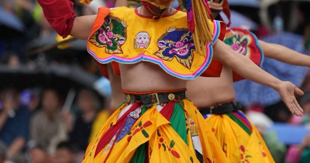Festival dancers in bright yellow costumes